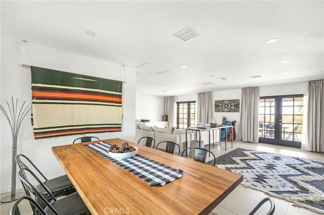 dining room featuring french doors and a healthy amount of sunlight