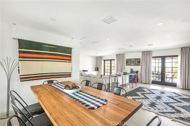 dining room with recessed lighting, visible vents, and french doors