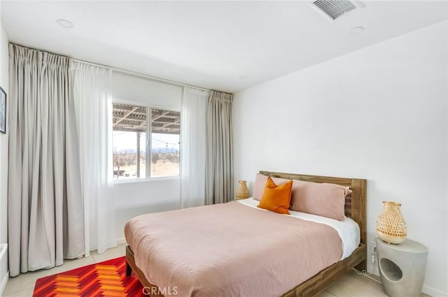 bedroom featuring visible vents
