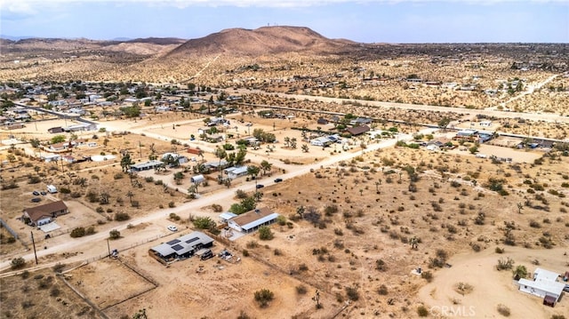 drone / aerial view featuring a mountain view