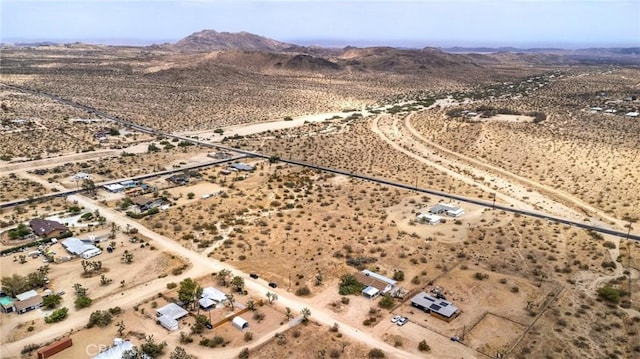 aerial view with a mountain view, a desert view, and a rural view