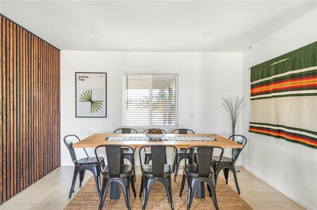 dining area featuring baseboards and light tile patterned floors