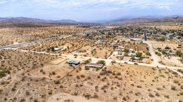 aerial view with a mountain view, a rural view, and view of desert