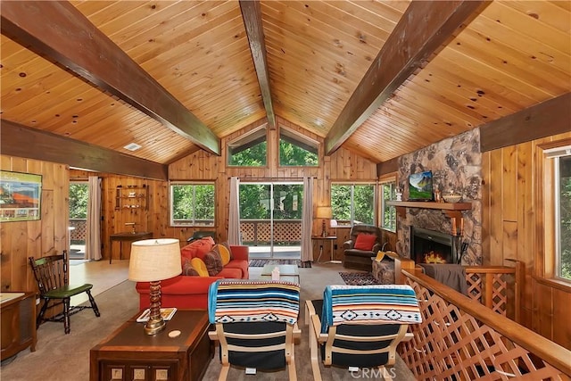 living room featuring wood ceiling, light colored carpet, vaulted ceiling with beams, and a stone fireplace