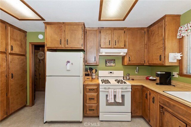 kitchen featuring sink and white appliances