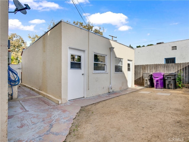 back of house featuring a patio