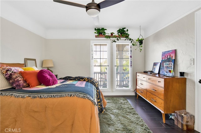 bedroom with dark wood-type flooring and ceiling fan