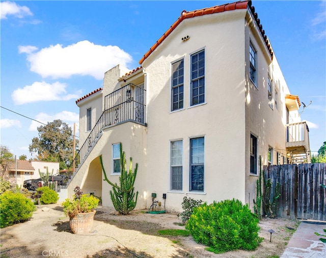 view of property exterior featuring a balcony