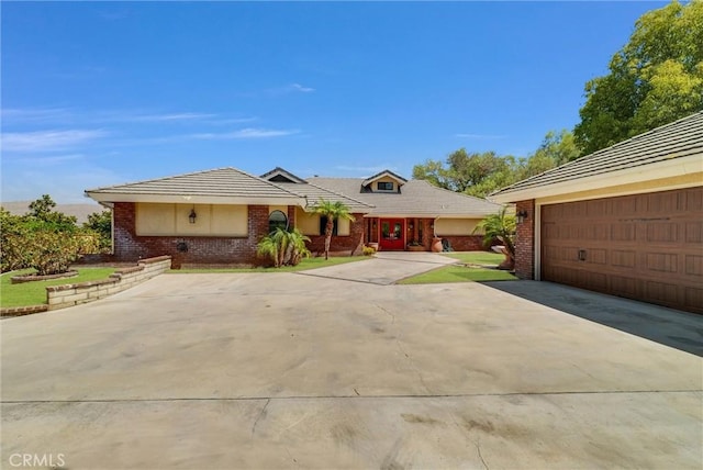 ranch-style house featuring a garage