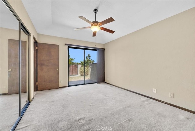 unfurnished bedroom with ceiling fan, access to exterior, light carpet, and a closet