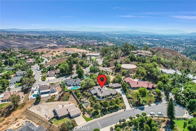 birds eye view of property featuring a mountain view