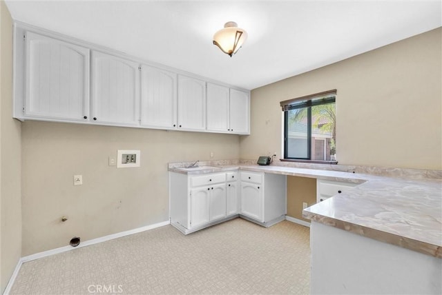 clothes washing area with cabinets, sink, and hookup for a washing machine