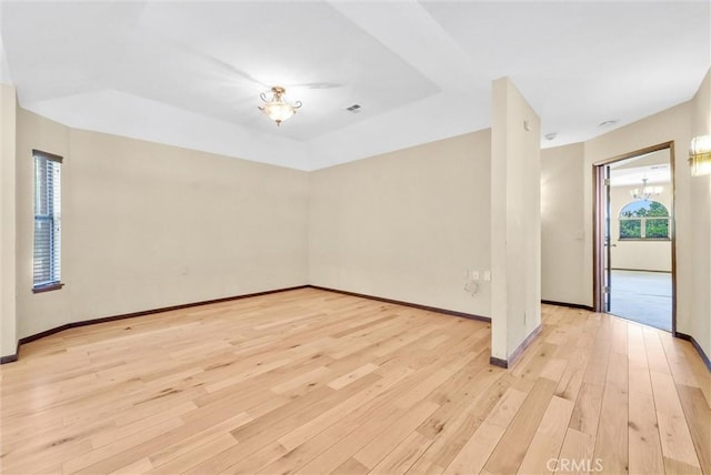 empty room with light hardwood / wood-style floors