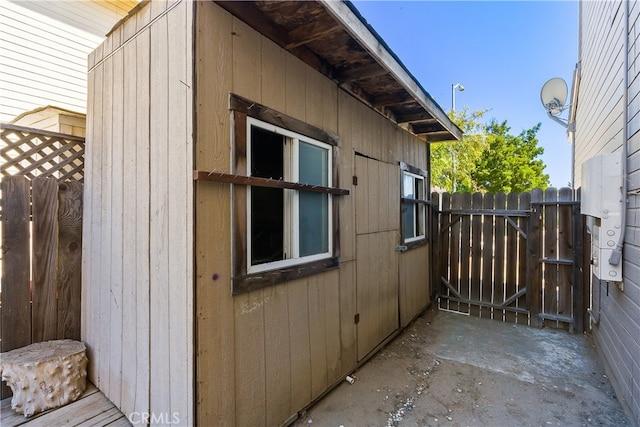 view of home's exterior featuring a storage unit