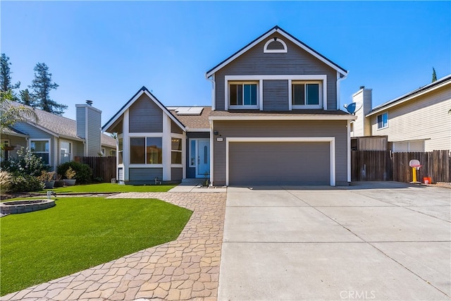 view of front of home with a garage and a front lawn