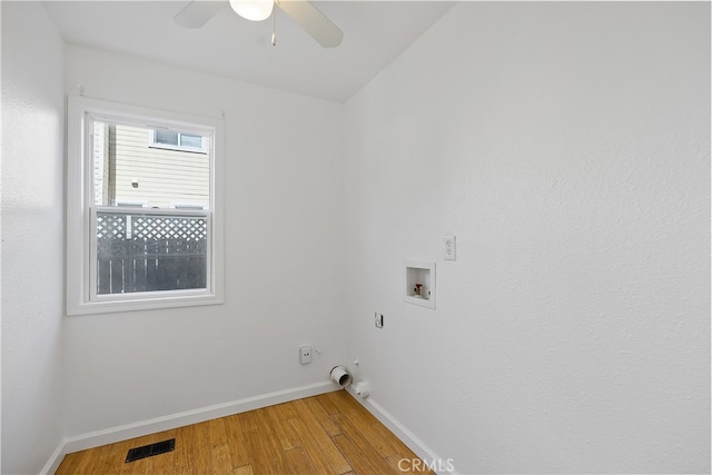 washroom featuring ceiling fan, washer hookup, and hardwood / wood-style floors