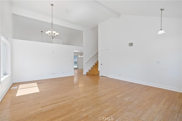 unfurnished room featuring light hardwood / wood-style flooring, beam ceiling, a notable chandelier, and high vaulted ceiling