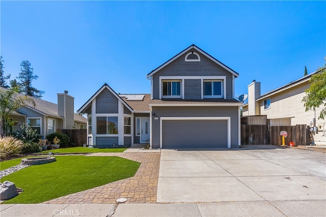 view of front facade with a front yard and a garage