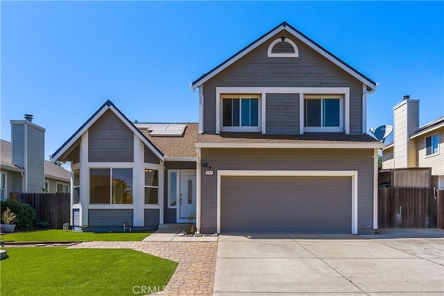 view of front facade with a front yard and a garage