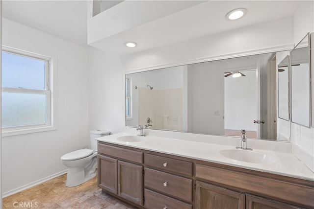 bathroom featuring ceiling fan, walk in shower, vanity, and toilet