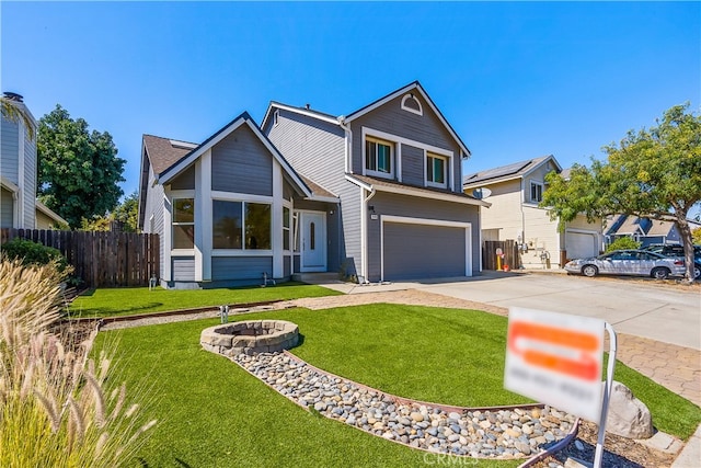 view of front of house with a front yard and a garage