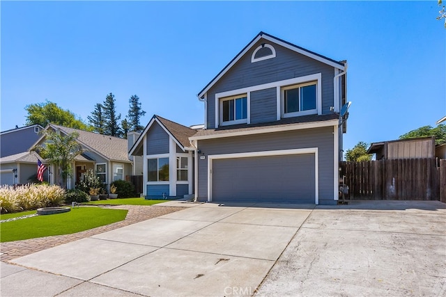 view of front of property with a front yard and a garage