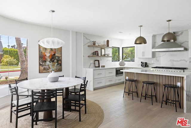 dining area with light hardwood / wood-style flooring