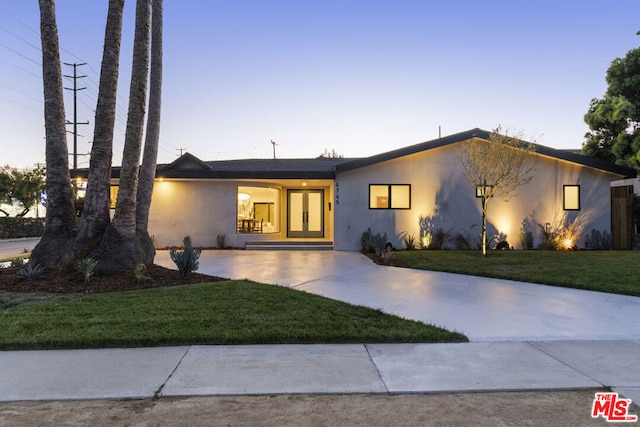 view of front of house with a lawn