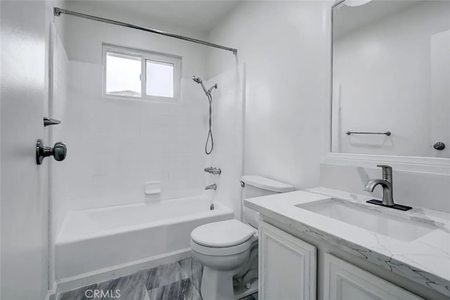 full bathroom with tiled shower / bath combo, vanity, and toilet