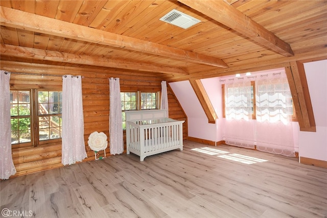 additional living space featuring a healthy amount of sunlight and light wood-type flooring