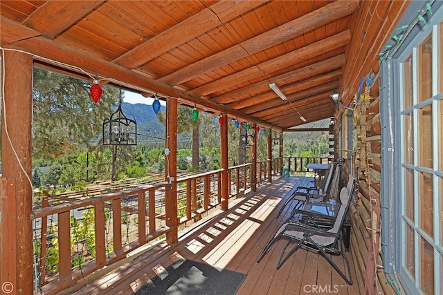 wooden deck featuring a mountain view