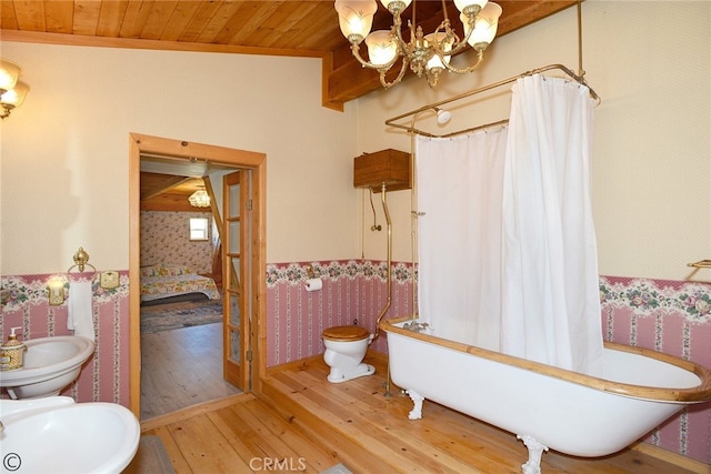 bathroom with hardwood / wood-style floors, wooden ceiling, an inviting chandelier, vaulted ceiling, and toilet