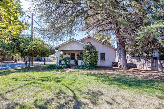 view of front of home with a front lawn