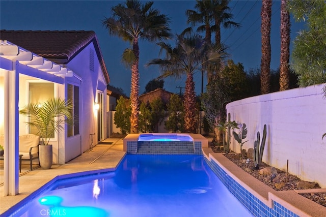 view of swimming pool featuring a patio area and a pool with connected hot tub