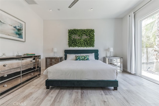 bedroom featuring recessed lighting, visible vents, light wood-style flooring, and access to outside