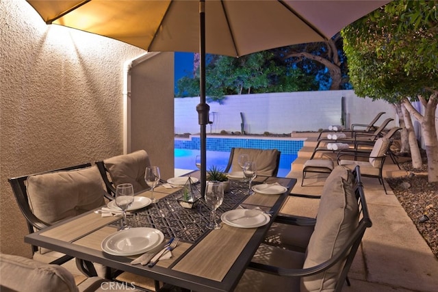 view of patio featuring a fenced in pool and a fenced backyard