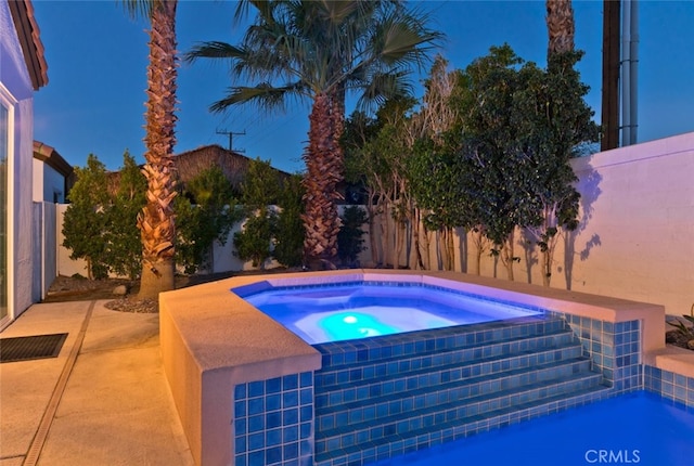 view of swimming pool with a patio area and a fenced backyard