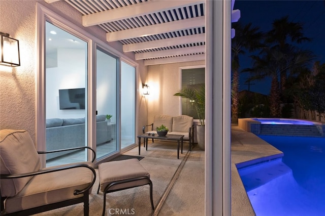 view of patio / terrace featuring a pool with connected hot tub and a pergola