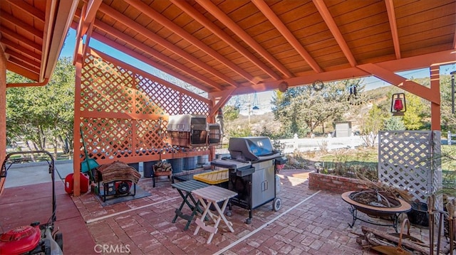 view of patio / terrace with an outdoor fire pit, area for grilling, and grilling area