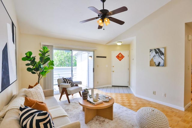 living room featuring ceiling fan, light parquet floors, and lofted ceiling