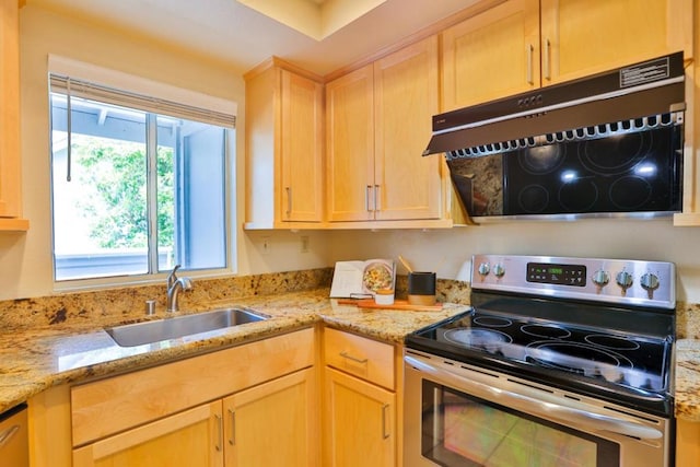 kitchen with sink, light stone counters, light brown cabinetry, and stainless steel electric range