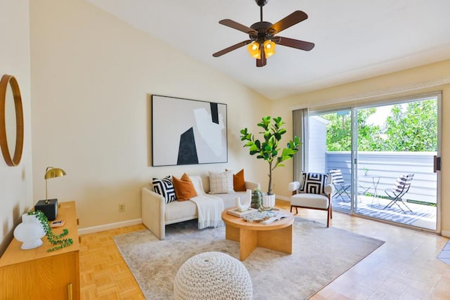 living room featuring lofted ceiling, light parquet floors, and ceiling fan