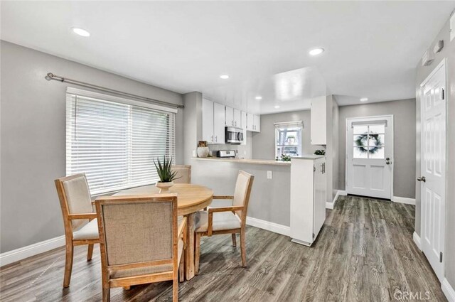 dining room with hardwood / wood-style flooring