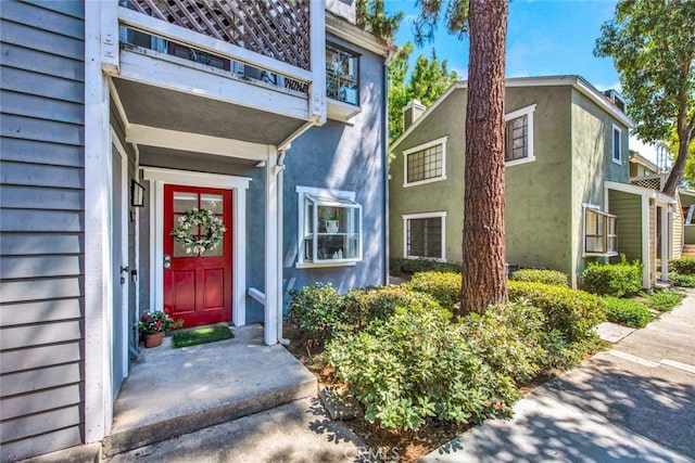 entrance to property with a balcony