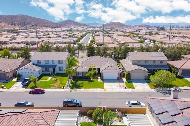 birds eye view of property with a residential view and a mountain view