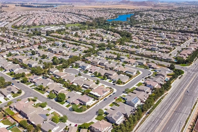 birds eye view of property with a water view and a residential view