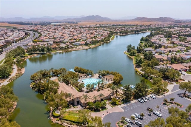 bird's eye view with a residential view and a water and mountain view