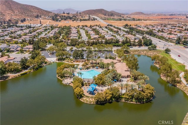 bird's eye view with a water and mountain view and a residential view