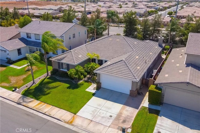 birds eye view of property with a residential view