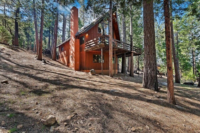 rear view of house featuring a deck